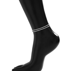 Detailed view of silver double-layered bead anklet on a model with metallic finish