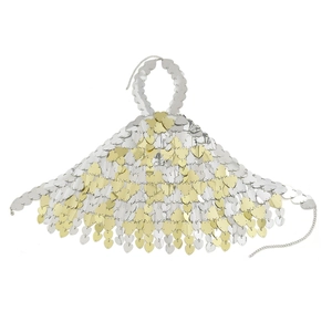 Detail view of heart-shaped sequins on a metallic backless body chain crop top