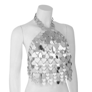 Detail of silver heart-shaped metal sequins and fringe tassels on a sexy body chain top