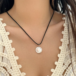 Minimalist beach style seashell pendant necklace on black wax cord for vacation