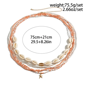 Detail view of Bohemian body chain with orange beads, shells, and starfish charm