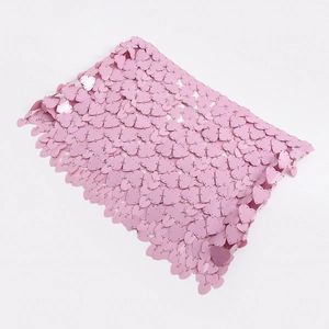 Detailed view of pink heart sequins joined by silver metal rings for body chain clothing