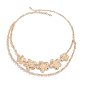 Detailed view of gold flower waist chain featuring hammered texture petals and dual layers