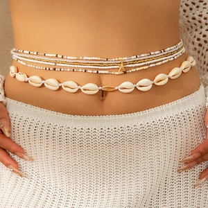 Bohemian gelaagde buikketting met schelpen, gekleurde kralen en een zeester hanger