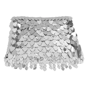 Close-up of heart-shaped silver sequins and metal chain links on a body chain skirt