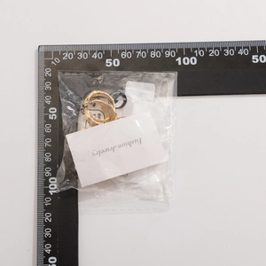 Detailed measurement of gold irregular lava ring with twisted texture on fashion card