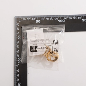 Detailed size measurement of gold irregular liquid lava open rings set on white background
