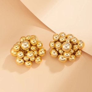 Detailed view of cluster gold metallic bubble earrings with polished geometric beads