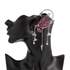 Detail of red elf wing ear cuff with silver chains, pearl flower and rabbit charm
