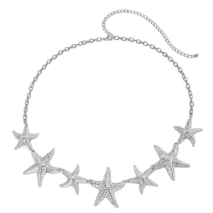 Detail view of starfish body chain with textured silver star pendants and lobster clasp