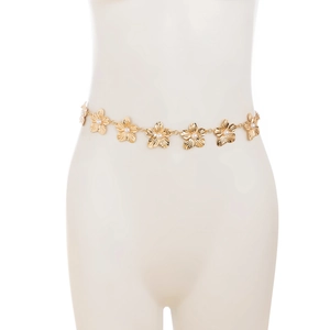 Detailed view of a gold flower waist chain featuring hollow petals and pearl center accents