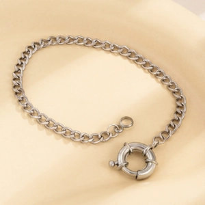 Detail of silver curb chain featuring a large industrial spring clasp closure