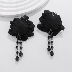 Detail of gothic black floral lace earrings with beaded tassels and drop pendants