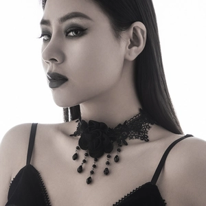 Detail view of Gothic black lace choker with textile rose and beaded tassel drops