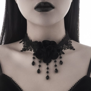 Close-up of black gothic lace choker with rose floral pendant and beaded fringe details