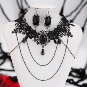 Detail of gothic lace choker and teardrop earrings with black gems and silver chains