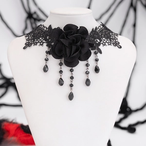 Close-up of black gothic lace choker with 3D rose flower and beaded fringe tassels
