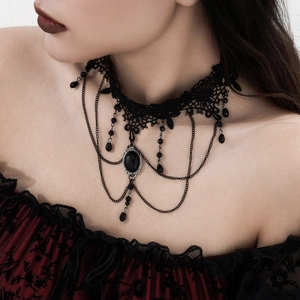 Detailed close-up of Gothic black lace choker featuring a dark gemstone and fringe beads