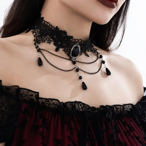 Detailed view of Gothic black lace choker featuring dark gemstone and teardrop tassels