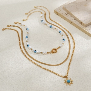 Dreilagiges goldene Schlangenkette-Set mit Perlen, bösem Blick und Sonnenanhänger