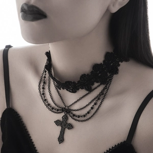 Detail of Gothic lace choker with multi-layer black chains and carved cross pendant