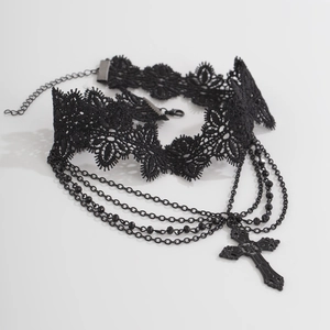 Detail of gothic lace choker with black crystal beads and dangling cross pendant