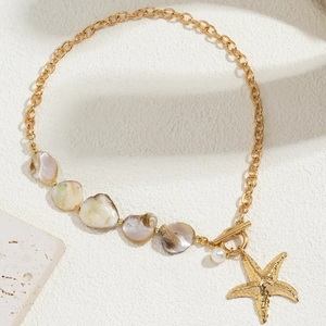 Bohemian mermaid pearl necklace with golden starfish and iridescent shell charms
