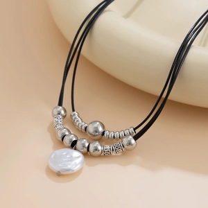 Bohemian double-layered necklace with black cord, silver beads, and baroque pearl pendant