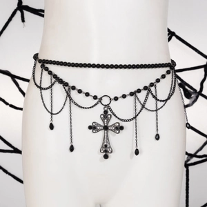 Gothic metal waist chain detail with a large cross pendant and black bead tassels