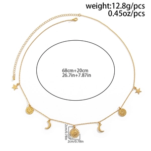 Detailed view of bohemian gold waist chain with sun and moon charms and size measurements