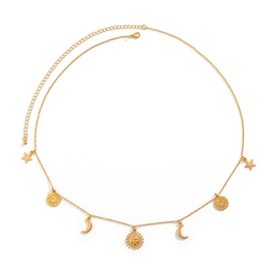 Detailed macro view of gold chain body belt with celestial sun, moon, and star pendants