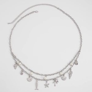 Detail of silver body chain with starfish, seashell pendants and white pearls charms