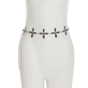 Detailed macro view of Gothic silver body chain featuring cross and skull charms with lobster clasp