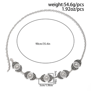 Detail of vintage silver moon and sun link waist chain with length measurements