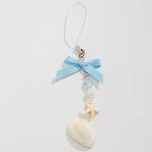 Detail of ocean-style phone charm with blue ribbon, starfish bead and natural seashell