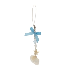 Detail of ocean-themed charm with natural starfish, shell, and blue bow on white background