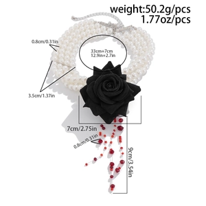 Detailed view of layered blood-stained pearl necklace with black rose and red crystal fringe