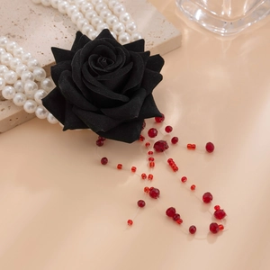 Detail of gothic black fabric rose pendant with bloody red beaded fringe tassels