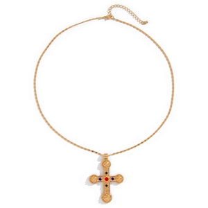 Collier croix dorée vintage avec pierres colorées et gravure en relief sur fond blanc