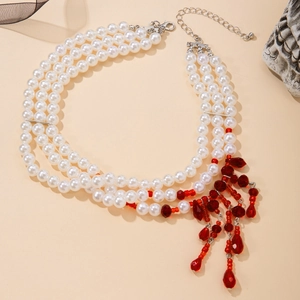 Detail of three-layer pearl necklace with red crystal waterdrop tassels for Halloween