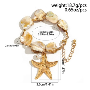 Ocean style shell bracelet with gold starfish charm and white pearl on white background