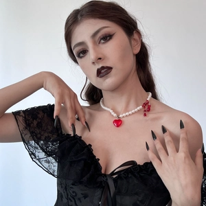 Gothic layered pearl necklace with heart pendant and red tassel detail for Halloween