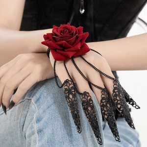 Detail of Gothic red rose wrist piece with black metal chains and five claw rings