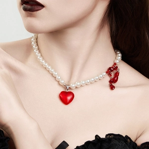 Gothic multilayer pearl necklace with red heart pendant and blood-like fringe details