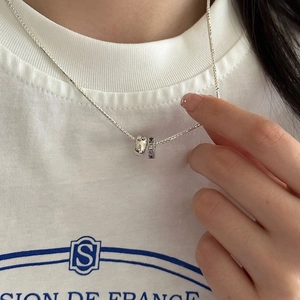 Rainbow zircon double ring pendant necklace in sterling silver worn on neck