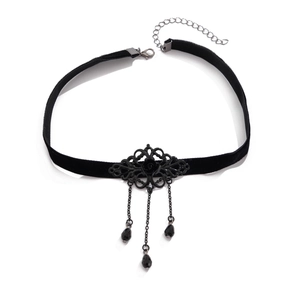 Detail of gothic black velvet choker with metal filigree, rose, and drop beads