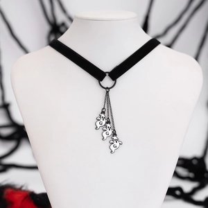 Detail of Halloween choker with velvet band and ghost charms on a model neck