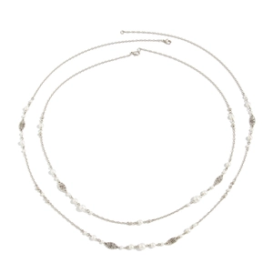 Detail view of retro long pearl necklace with silver hollow pattern beads and lobster clasp