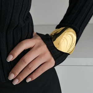 Minimalist gold oversized irregular smooth cuff bracelet for women in trendy metallic style