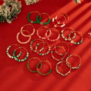 Christmas hoop earrings with festive red white and green beads and Santa Claus charms